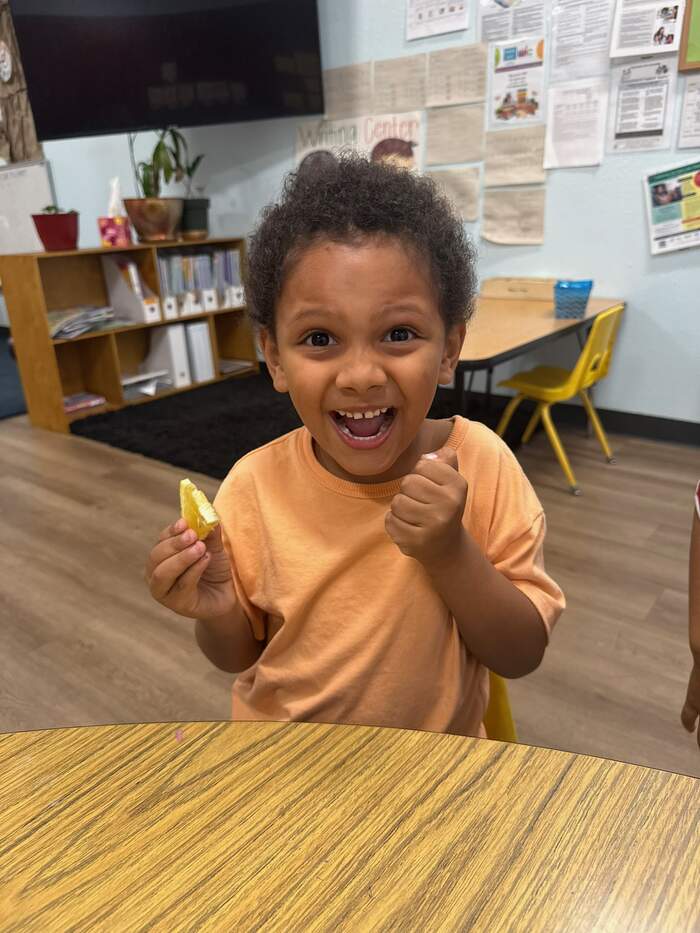 Child excited about a snack at Sunny West