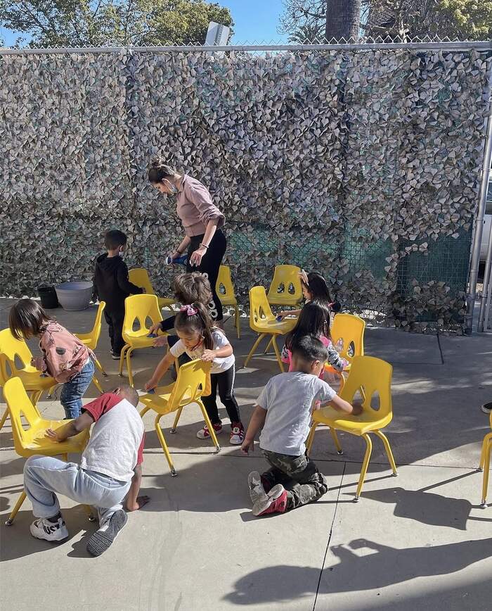 Children playing outdoors in the Sunny West garden area